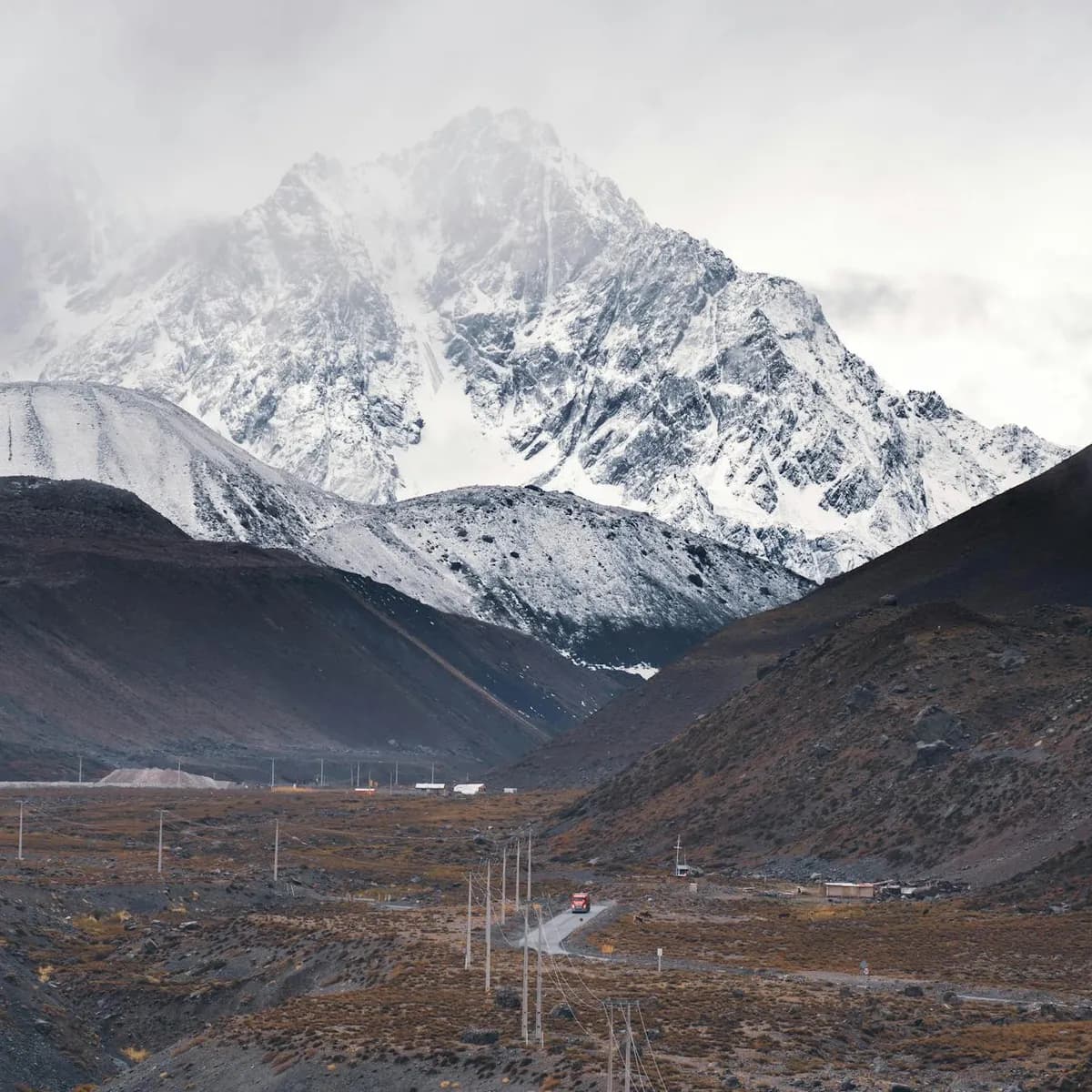 Snow leopard in mountain terrain